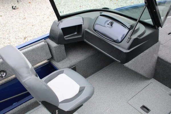 Slide: The Image of 2023 Lowe FM1675 boat interior with seating and storage compartments. - 1