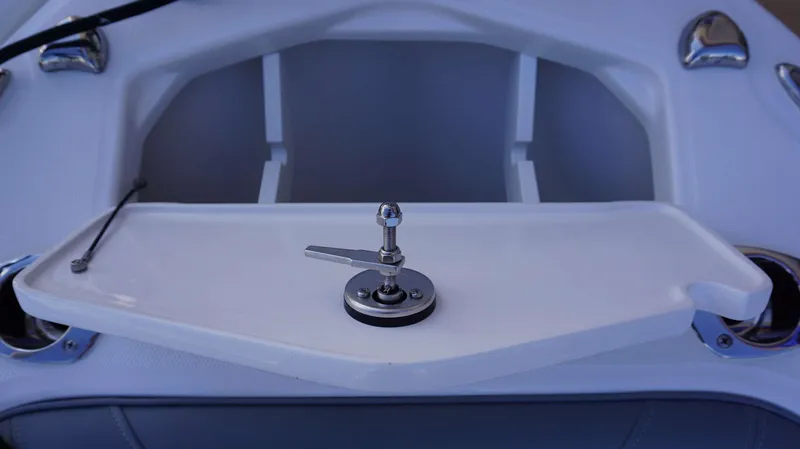 Slide: The Image of 2023 Everglades 243 CC boat interior detail with white tray and metal fixture. - 20