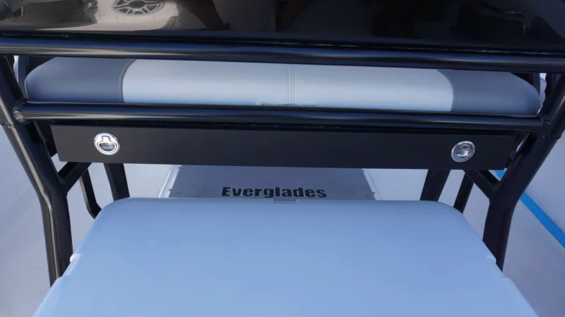 Slide: The Image of 2023 Everglades 243 CC boat interior with seating and storage. - 23