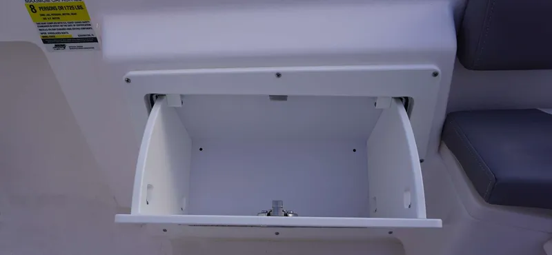 Slide: The Image of Open storage compartment on 2023 Everglades 243 CC boat interior. - 26
