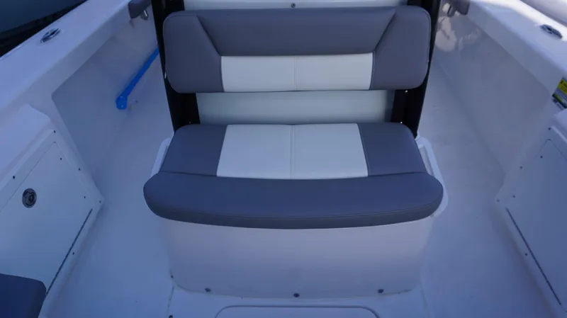 Slide: The Image of 2023 Everglades 243 CC boat seat, gray and white cushioned design. - 27