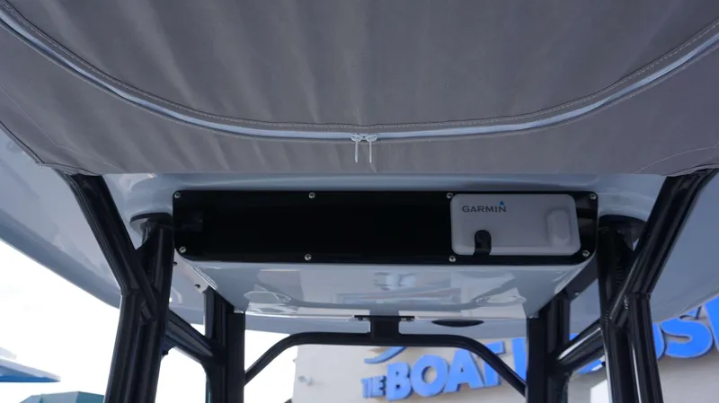 Slide: The Image of 2023 Everglades 243 CC boat with Garmin equipment under canopy. - 7