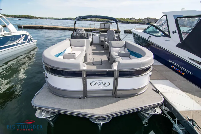 Slide: The Image of 2022 Manitou 25 Encore RF SHP pontoon boat docked at marina. - 1