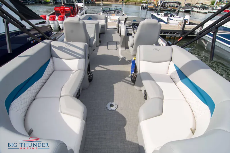Slide: The Image of 2022 Manitou 25 Encore RF SHP pontoon boat interior with spacious seating. - 5