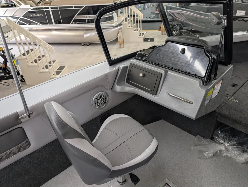 Slide: The Image of 2023 Starcraft Superfisherman 186 boat interior with seating and console. - 4