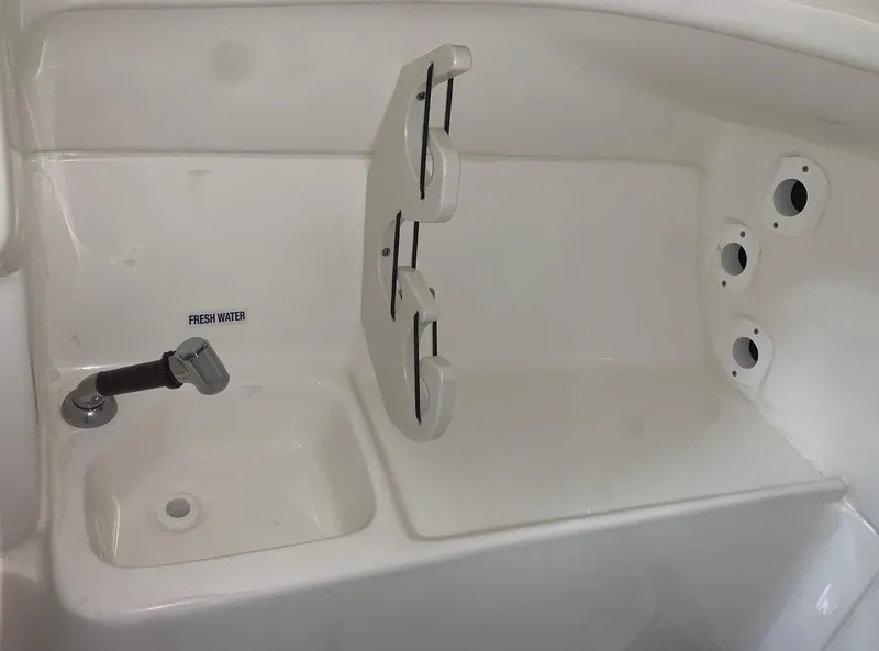 Slide: The Image of 2024 Key West 239 DFS boat sink and storage compartment. - 14