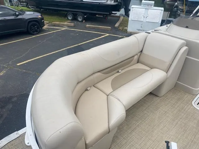 Slide: The Image of 2017 JC 245 TT Spirit boat with beige cushioned seating. - 10