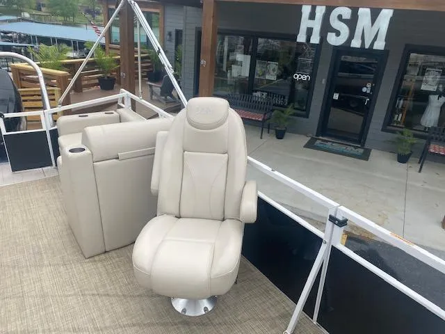Slide: The Image of 2017 JC 245 TT Spirit boat with beige captain's chair and seating area. - 11