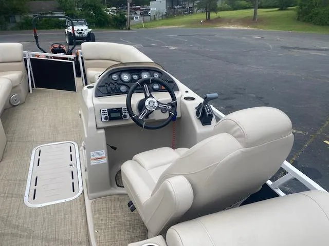 Slide: The Image of 2017 JC 245 TT Spirit boat interior with steering wheel and seating. - 17