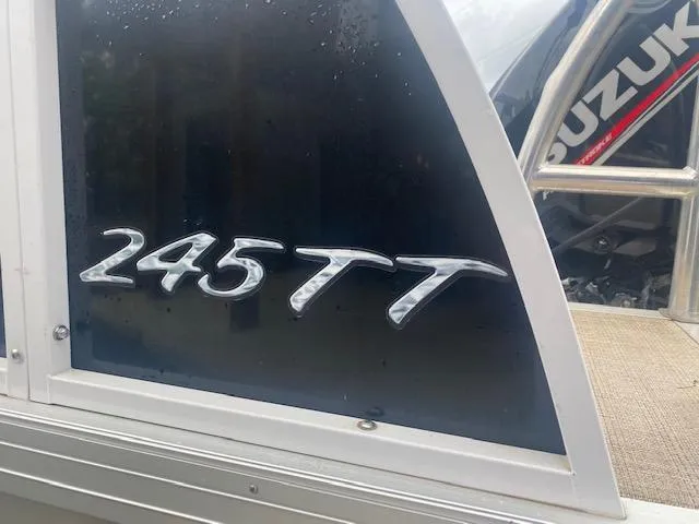 Slide: The Image of 2017 JC 245 TT Spirit boat model emblem with Suzuki engine in background. - 6