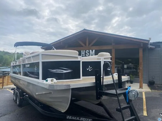 Slide: The Image of 2017 JC 245 TT Spirit pontoon boat on trailer outside HSM building. - 8