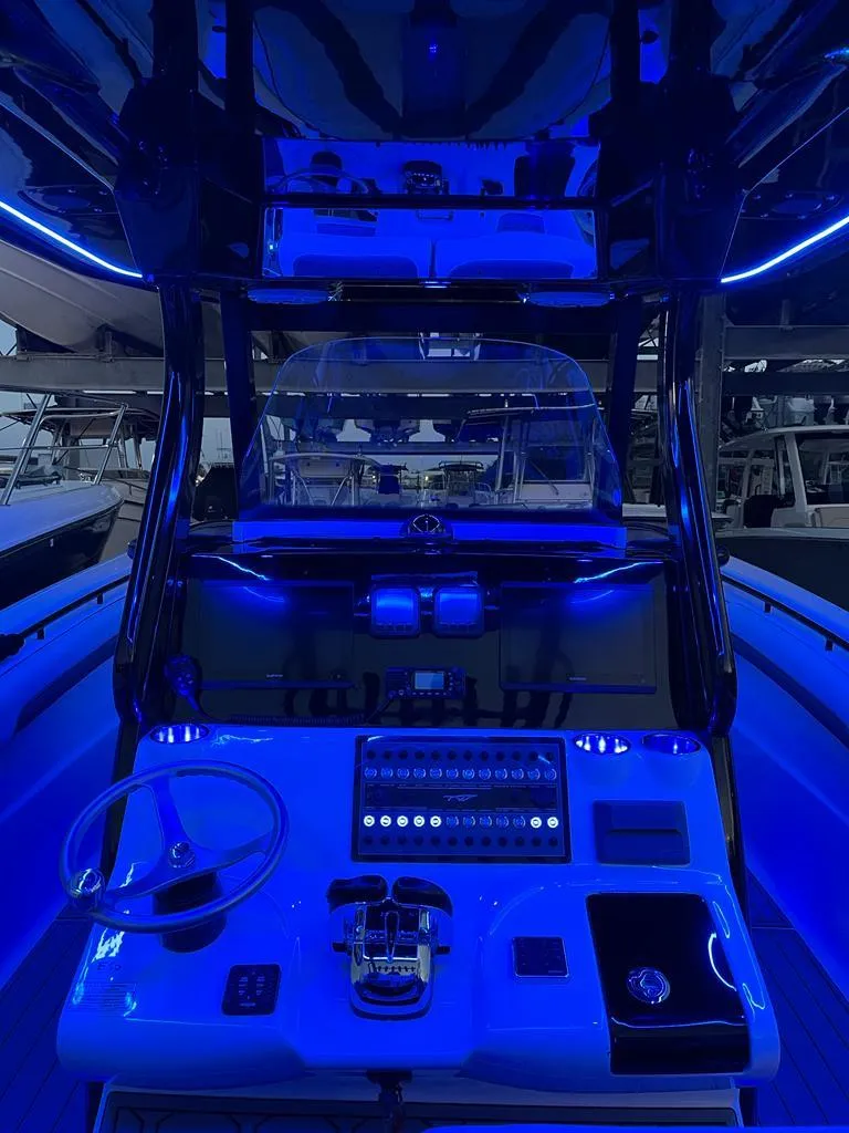 Slide: The Image of 2020 Tidewater 32 boat cockpit with blue LED lighting. - 12