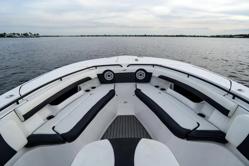 Slide: The Image of 2020 Tidewater 32 boat interior with spacious seating on calm water. - 18