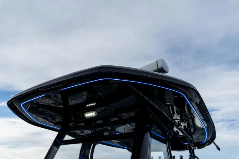 Slide: The Image of Tidewater 32 boat roof with LED lights against a cloudy sky, 2020 model. - 23