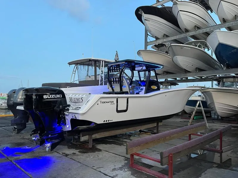 Slide: The Image of 2020 Tidewater 32 boat with Suzuki engines in a marina storage. - 4