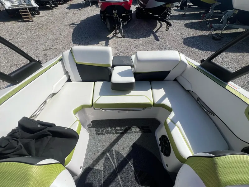 Slide: The Image of 2014 Scarab 195 HO Impulse boat interior with white and green seating. - 6