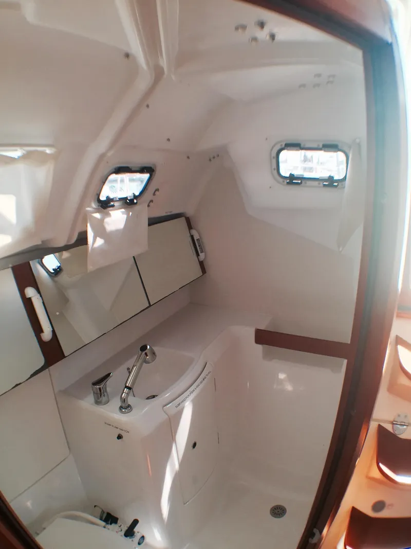 Slide: The Image of 2014 Beneteau Oceanis 34 bathroom with sink and mirror. - 10