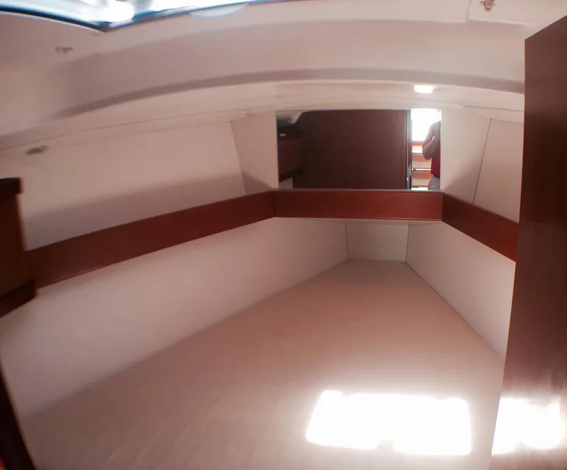 Slide: The Image of Interior cabin of 2014 Beneteau Oceanis 34 sailboat with natural light. - 12