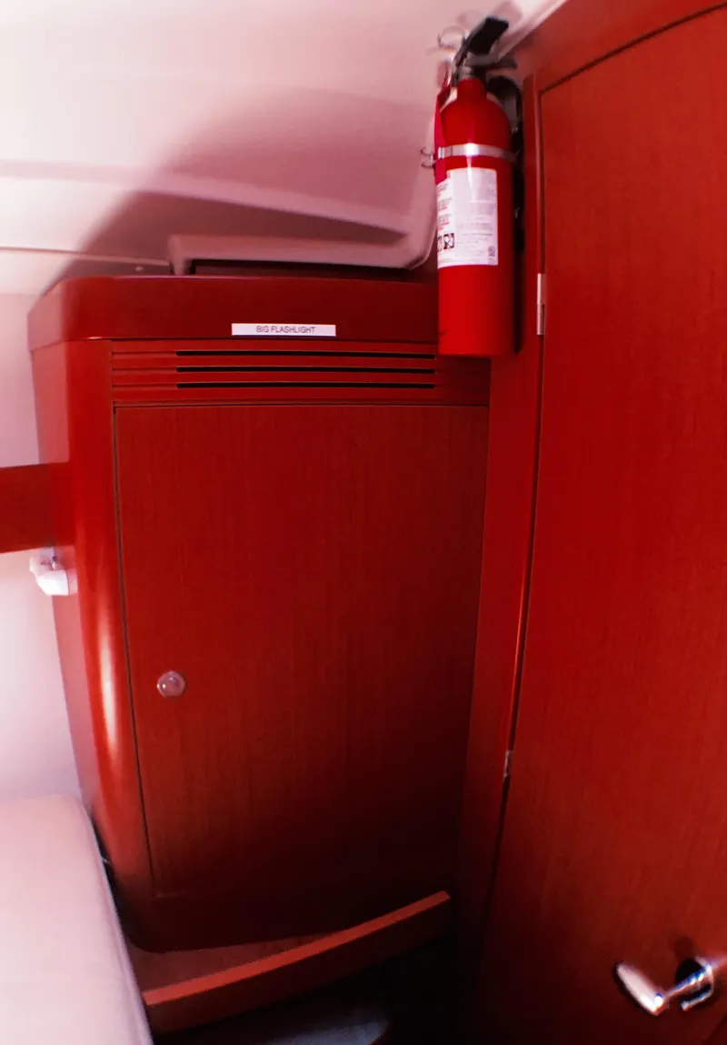 Slide: The Image of Interior of 2014 Beneteau Oceanis 34 sailboat with fire extinguisher. - 13