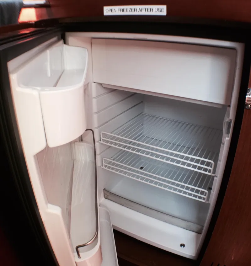 Slide: The Image of Open refrigerator inside a 2014 Beneteau Oceanis 34 sailboat. - 17