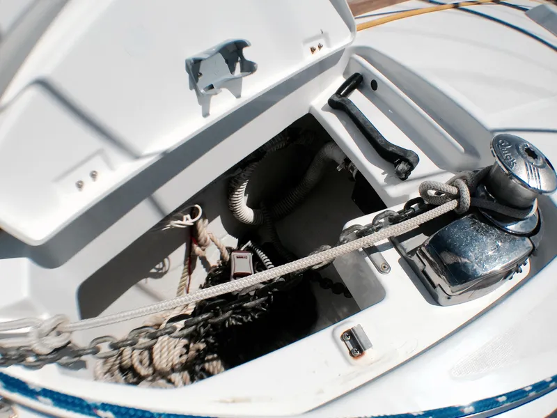 Slide: The Image of Anchor locker of 2014 Beneteau Oceanis 34 sailboat with windlass and chain. - 21