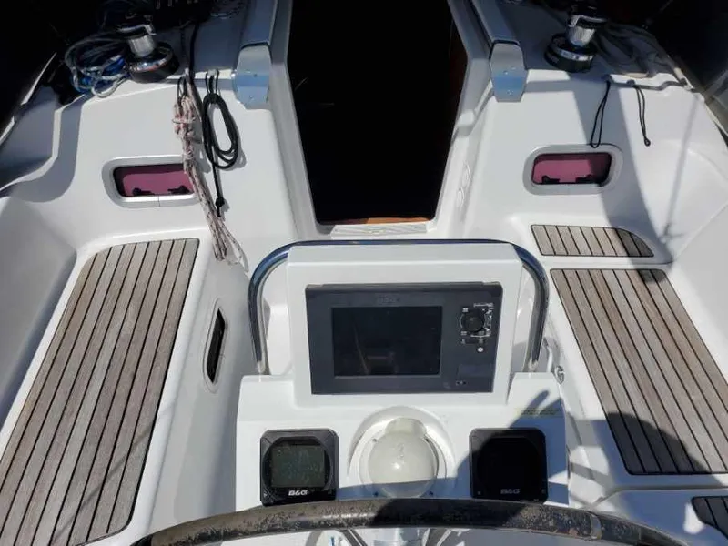 Slide: The Image of Cockpit of 2014 Beneteau Oceanis 34 sailboat with navigation equipment. - 23