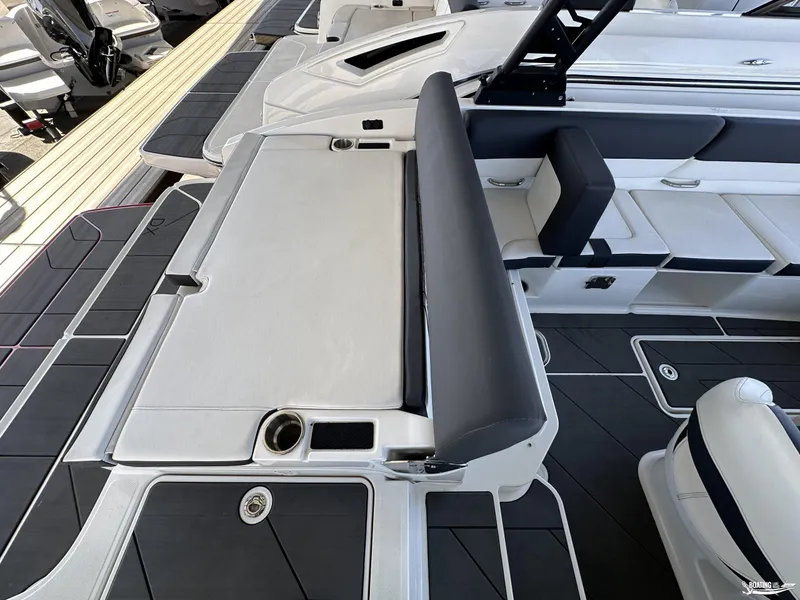 Slide: The Image of 2023 Bayliner DX2050 boat interior with sleek seating and modern design. - 7