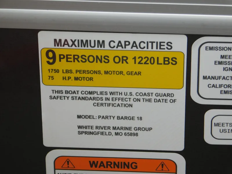 Slide: The Image of 2023 Sun Tracker Party Barge 18 DLX capacity label: 9 persons or 1220 lbs, 75 HP motor. - 13