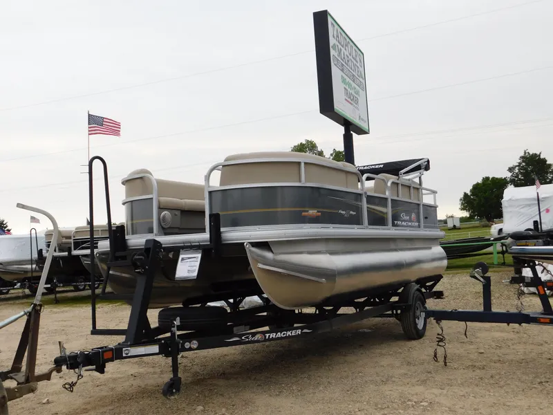 Slide: The Image of 2023 Sun Tracker Party Barge 18 DLX pontoon boat on trailer. - 2