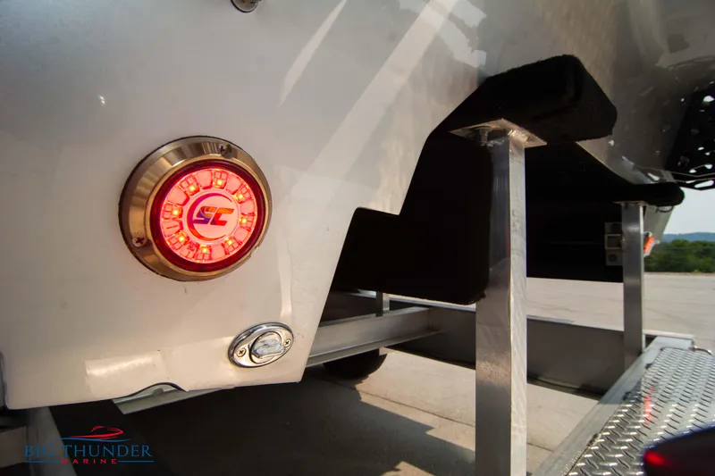 Slide: The Image of 2025 Fountain 34 Thunder Cat boat trailer with illuminated rear light. - 14