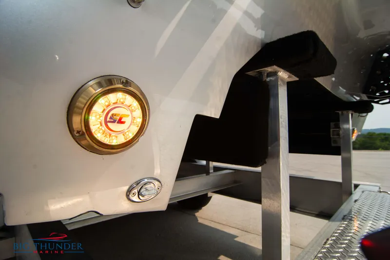 Slide: The Image of 2025 Fountain 34 Thunder Cat boat trailer detail with light and support structure. - 15