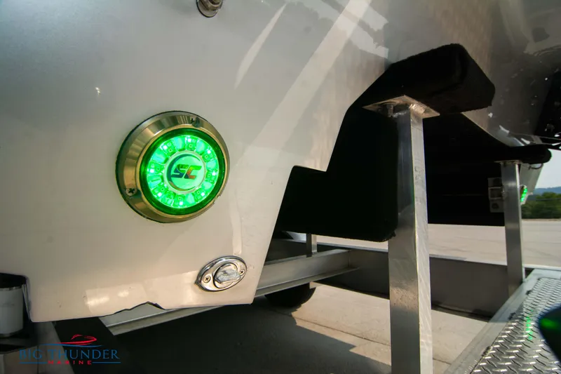 Slide: The Image of Close-up of 2025 Fountain 34 Thunder Cat boat with green LED light. - 17