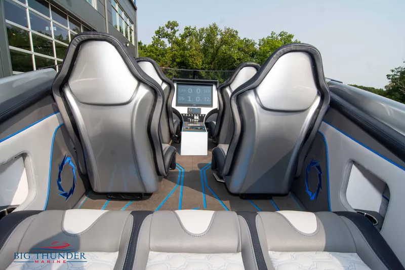 Slide: The Image of Interior of 2025 Fountain 34 Thunder Cat boat with modern seating and control panel. - 21