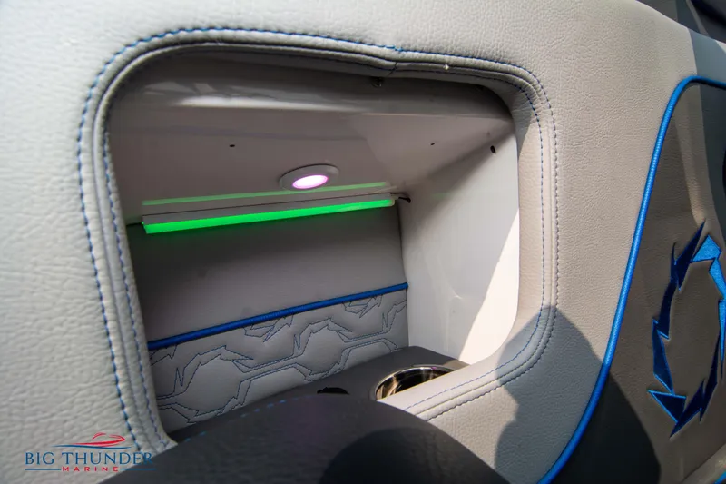 Slide: The Image of Interior storage compartment of a 2025 Fountain 34 Thunder Cat boat with LED lighting. - 26