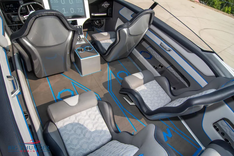 Slide: The Image of Interior of 2025 Fountain 34 Thunder Cat boat with modern seating and dashboard. - 27
