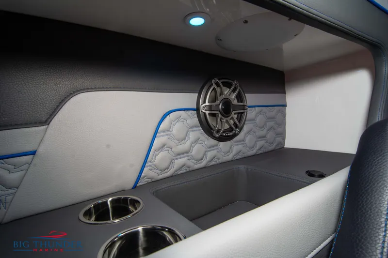 Slide: The Image of Interior of 2025 Fountain 34 Thunder Cat boat with speaker and cup holders. - 33