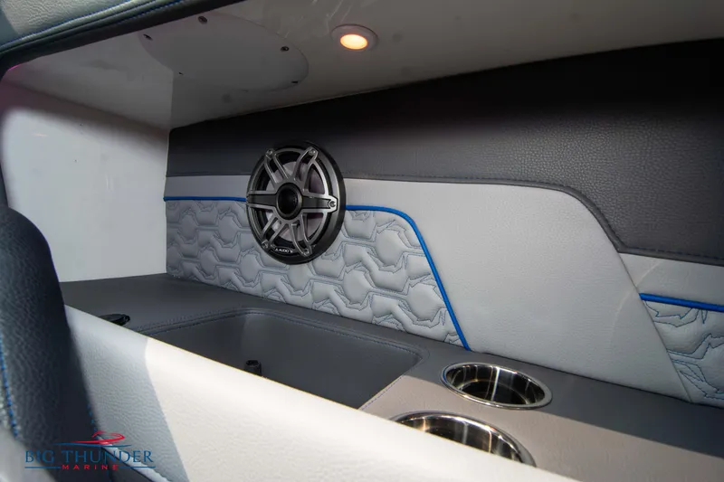 Slide: The Image of Interior of 2025 Fountain 34 Thunder Cat with speaker and cup holders. - 34