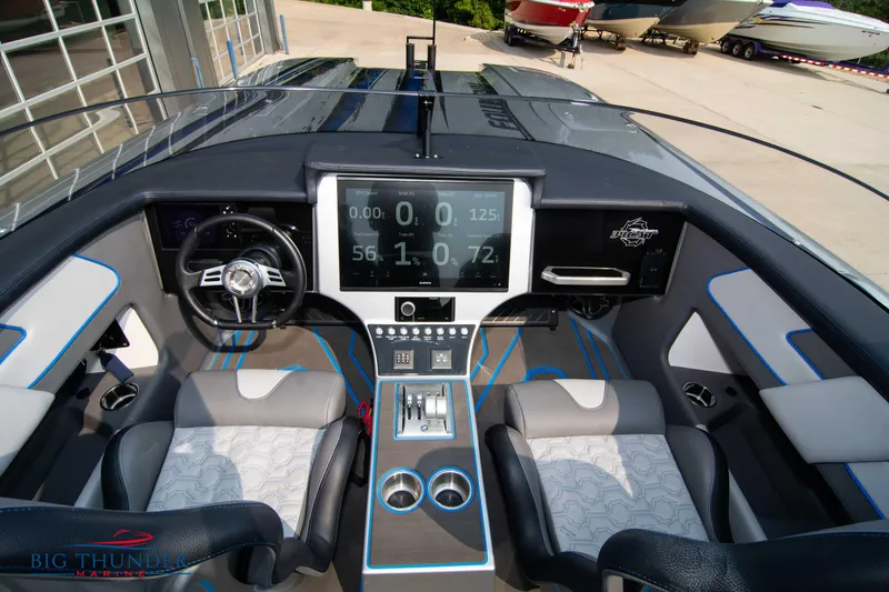 Slide: The Image of 2025 Fountain 34 Thunder Cat cockpit with modern dashboard and dual seating. - 35