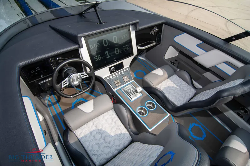 Slide: The Image of Interior of a 2025 Fountain 34 Thunder Cat boat with modern dashboard and seating. - 36