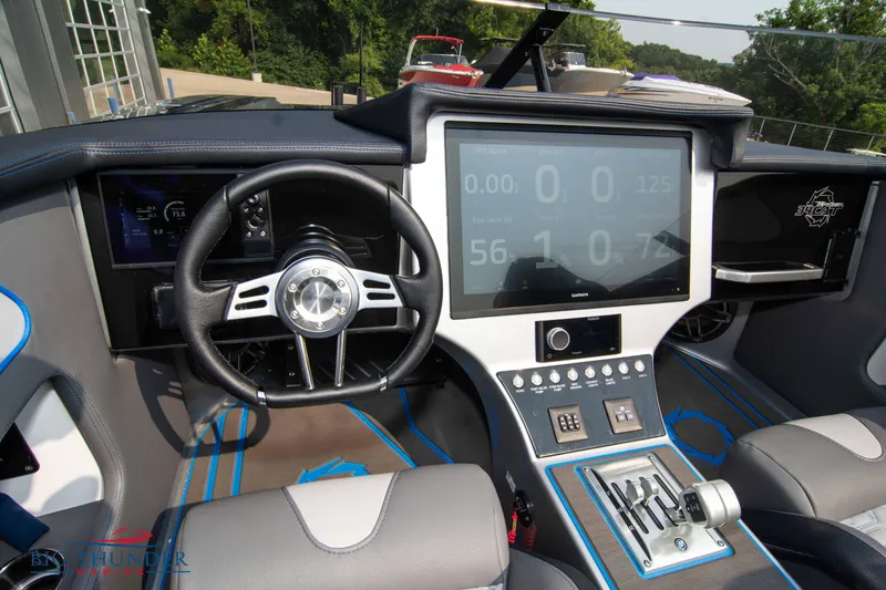 Slide: The Image of 2025 Fountain 34 Thunder Cat boat cockpit with advanced navigation system and steering wheel. - 38