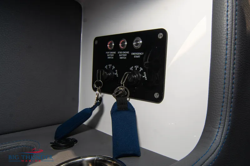 Slide: The Image of Control panel of a 2025 Fountain 34 Thunder Cat boat with ignition keys. - 46