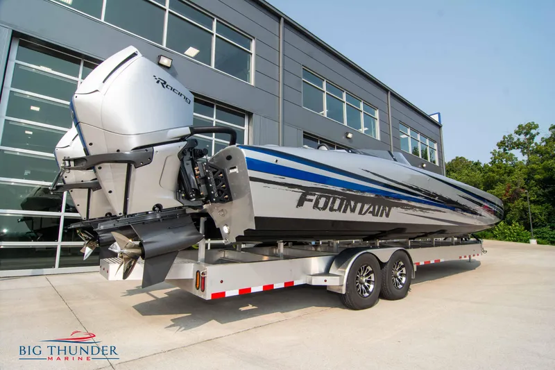Slide: The Image of 2025 Fountain 34 Thunder Cat boat on trailer outside Big Thunder Marine. - 5