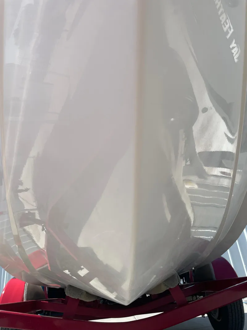 Slide: The Image of 1996 Four Winns 190 Horizon DLX boat hull on trailer, close-up view. - 11