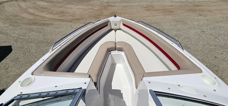 Slide: The Image of 1996 Four Winns 190 Horizon DLX bow seating area with beige and red upholstery. - 15