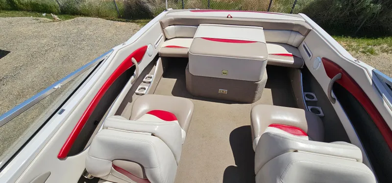 Slide: The Image of 1996 Four Winns 190 Horizon DLX boat interior with white and red seating. - 16