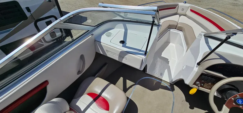 Slide: The Image of 1996 Four Winns 190 Horizon DLX boat interior with seating and dashboard. - 18