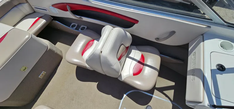 Slide: The Image of Interior of a 1996 Four Winns 190 Horizon DLX boat with beige and red seating. - 19