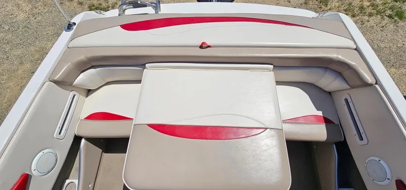 Slide: The Image of 1996 Four Winns 190 Horizon DLX boat interior with beige and red seating. - 22