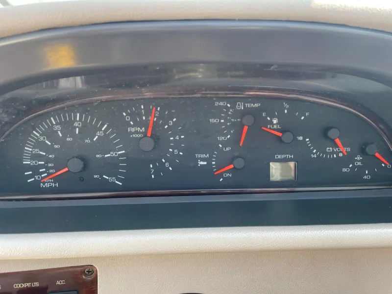 Slide: The Image of Dashboard of a 1996 Four Winns 190 Horizon DLX boat with various gauges. - 25