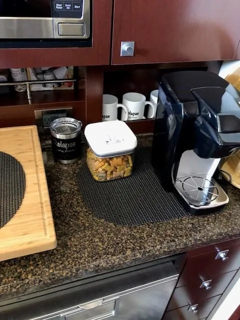Slide: The Image of Kitchen counter on a 2007 Sea Ray 36 Sedan Bridge with coffee maker and snacks. - 10